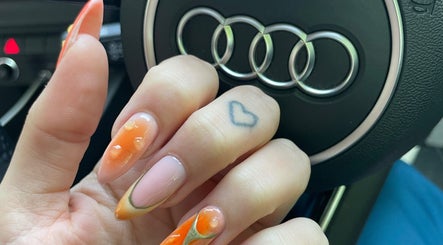 Stylish nail art at LSNAILBAR, Dumfries, Scotland, GB, showcasing vibrant orange and pink tones.