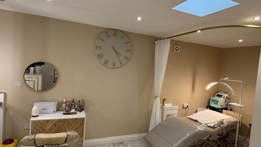 Modern treatment room at CD Studio, featuring a massage table and beauty equipment in London, England, GB.