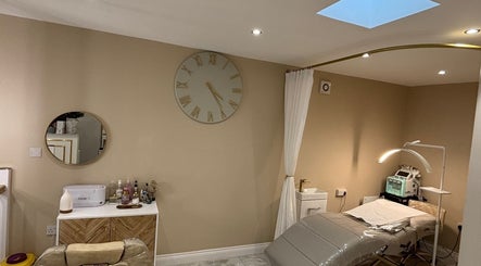 Modern treatment room at CD Studio, featuring a massage table and beauty equipment in London, England, GB.