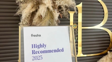 CD studio, London, England, GB display of Fresha 2025 Highly Recommended award in elegant setup.