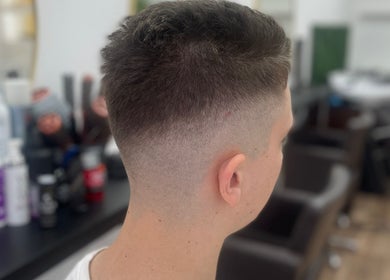 Close-up of a modern fade haircut at JFM hair, Aberdeen, Scotland, GB. Perfect style for a fresh look.