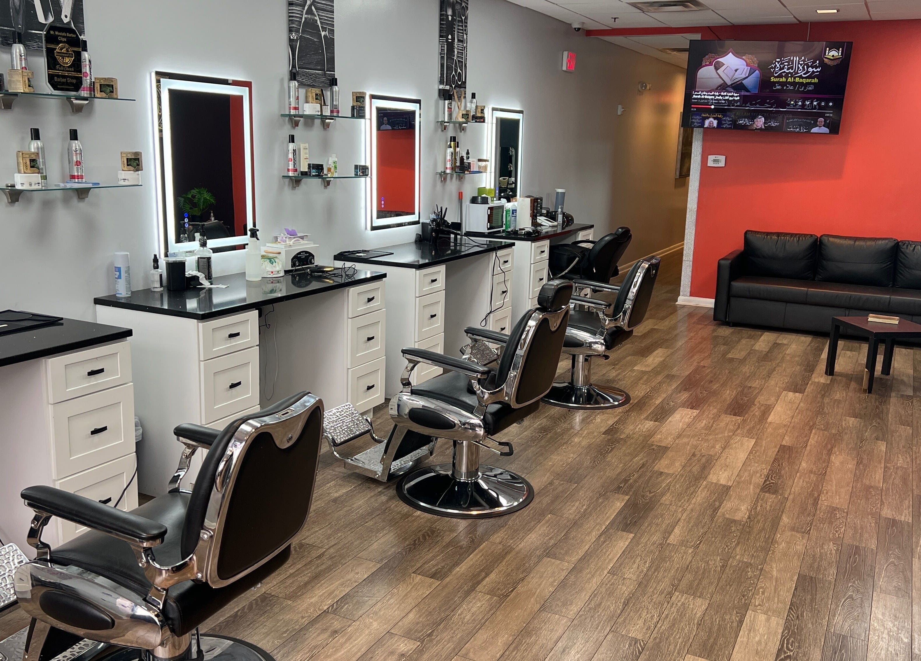 Modern barber chairs at King Mostafa's Clips in Falls Church, Virginia, US, showcasing sleek interior design.