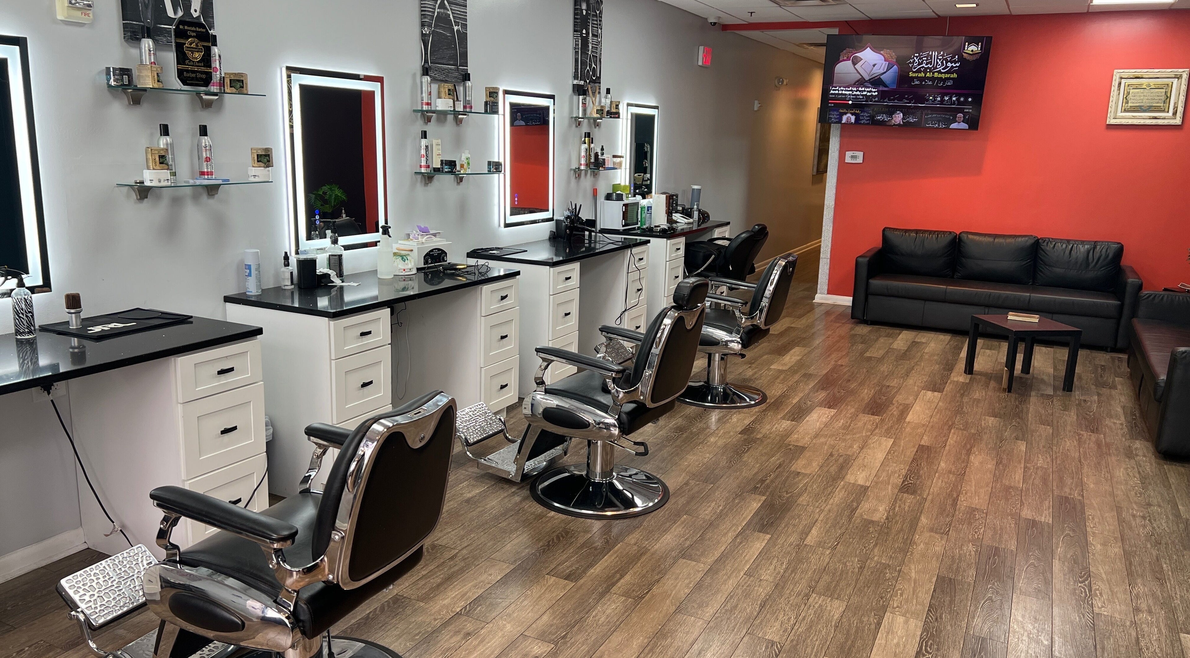 Modern barber chairs at King Mostafa's Clips in Falls Church, Virginia, US, showcasing sleek interior design.