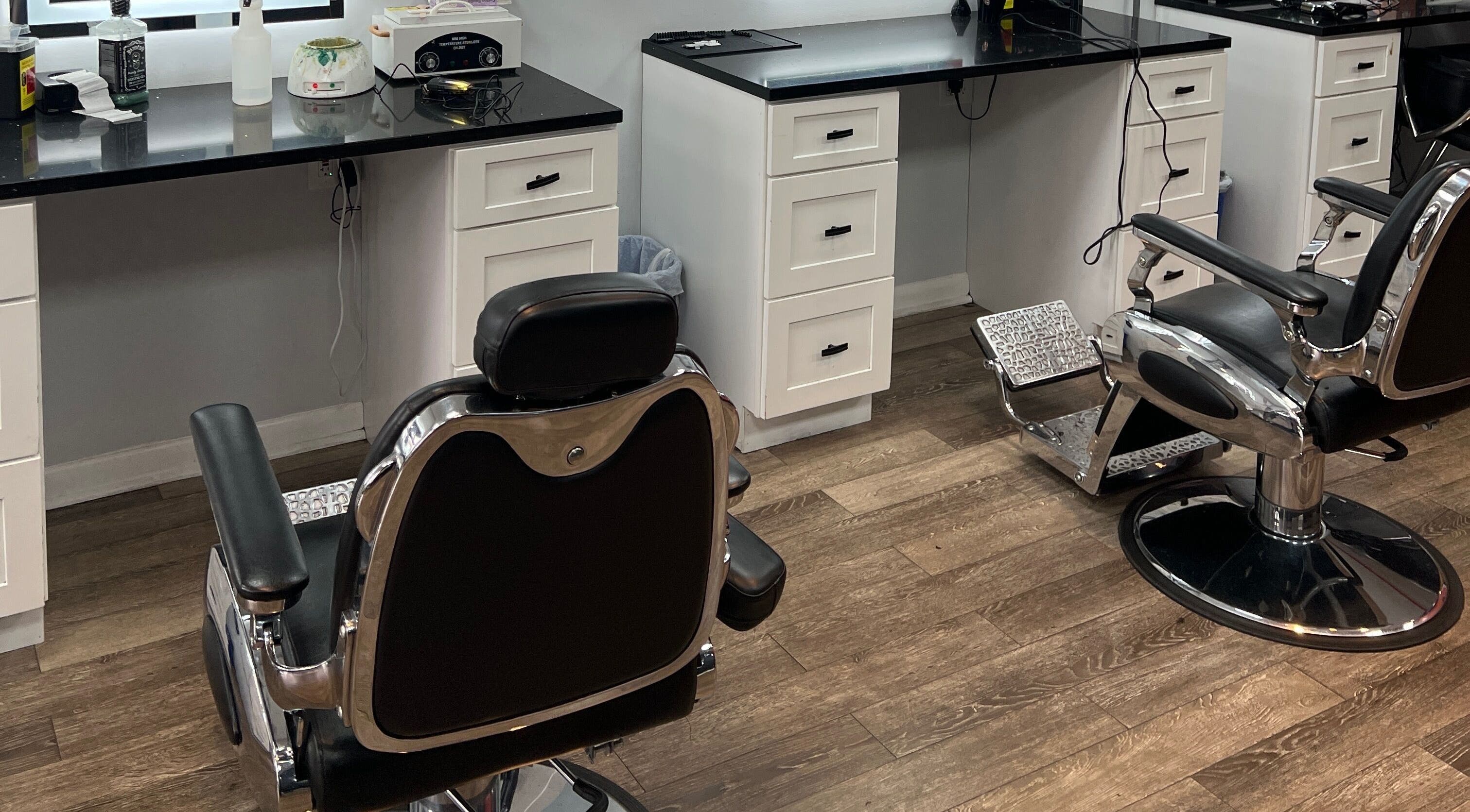 Modern salon setup at King Mostafa's Clips in Falls Church, Virginia, US featuring sleek barber chairs.