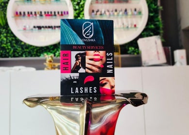 Beauty services display at Lovushka Beauty Salon, Doha, Doha Municipality, QA, featuring hair, nails, and lashes.