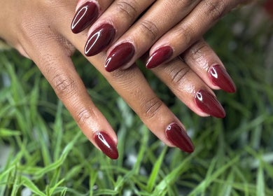 Elegant crimson nails by Noelin Artistry Studio, Pretoria, Gauteng, ZA, showcasing sleek and stylish manicure.