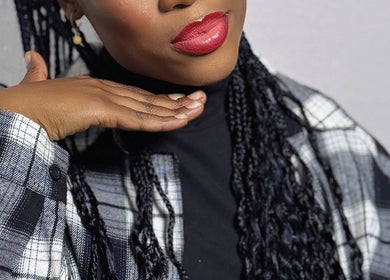 Elegant woman with braided hair at Noelin Artistry Studio, Pretoria, Gauteng, ZA.