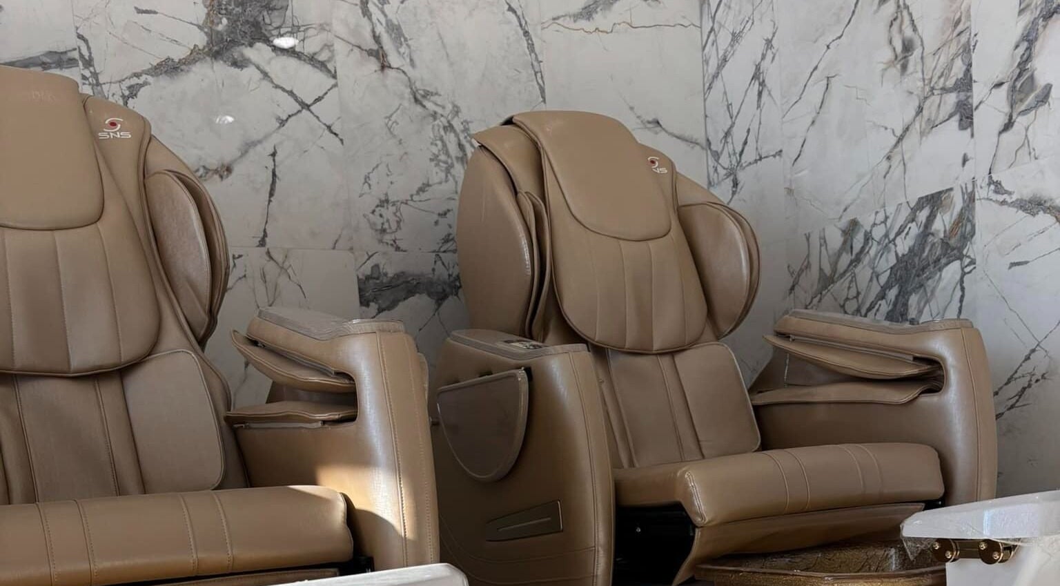 Comfortable massage chairs at Forever Nails in Pickerington, Ohio, US offer relaxation and pampering.