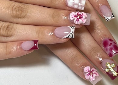 Elegant floral nail art at Muse Sculpt Studio, Wolverhampton, England, GB showcasing intricate designs.