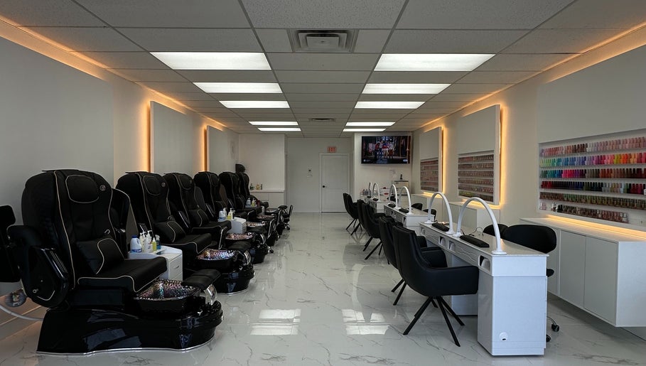 Sunny Nails Guelph interior with manicure stations and massage chairs in Guelph, Ontario, CA.