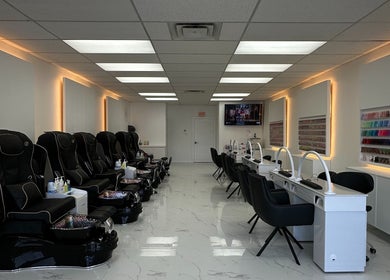 Sunny Nails Guelph interior with manicure stations and massage chairs in Guelph, Ontario, CA.