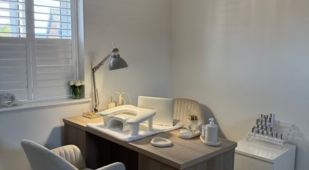 Elegant nail station at BAJE STUDIO, Burgess Hill, England, GB, featuring cozy chair and nail essentials.