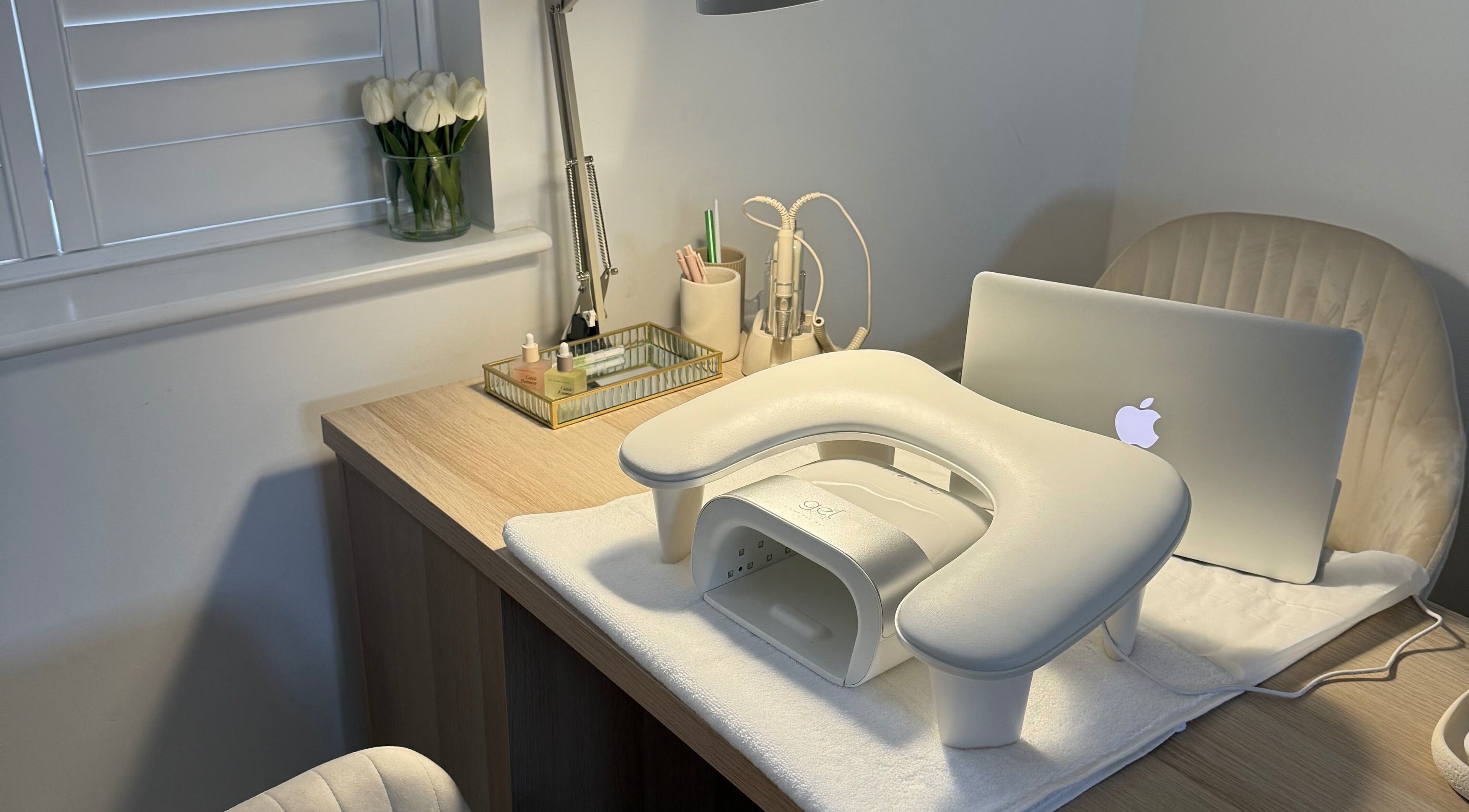 Modern nail station at BAJE STUDIO, Burgess Hill, England, GB with elegant decor and professional setup.