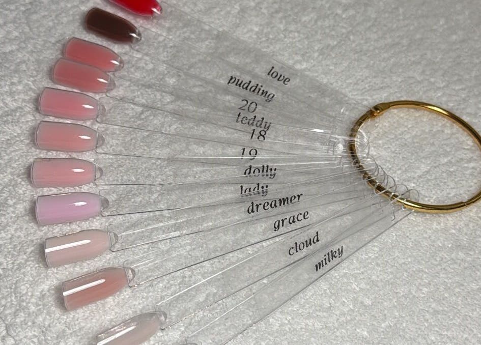 BAJE STUDIO nail polish swatches displayed in Burgess Hill, England, GB with various pink shades.