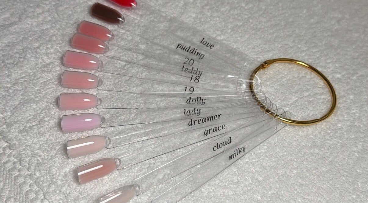 BAJE STUDIO nail polish swatches displayed in Burgess Hill, England, GB with various pink shades.