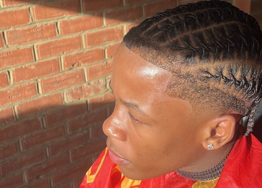 Intricate braided hairstyle at kcutz, Welwyn Garden City, England, GB, showcasing expert styling.