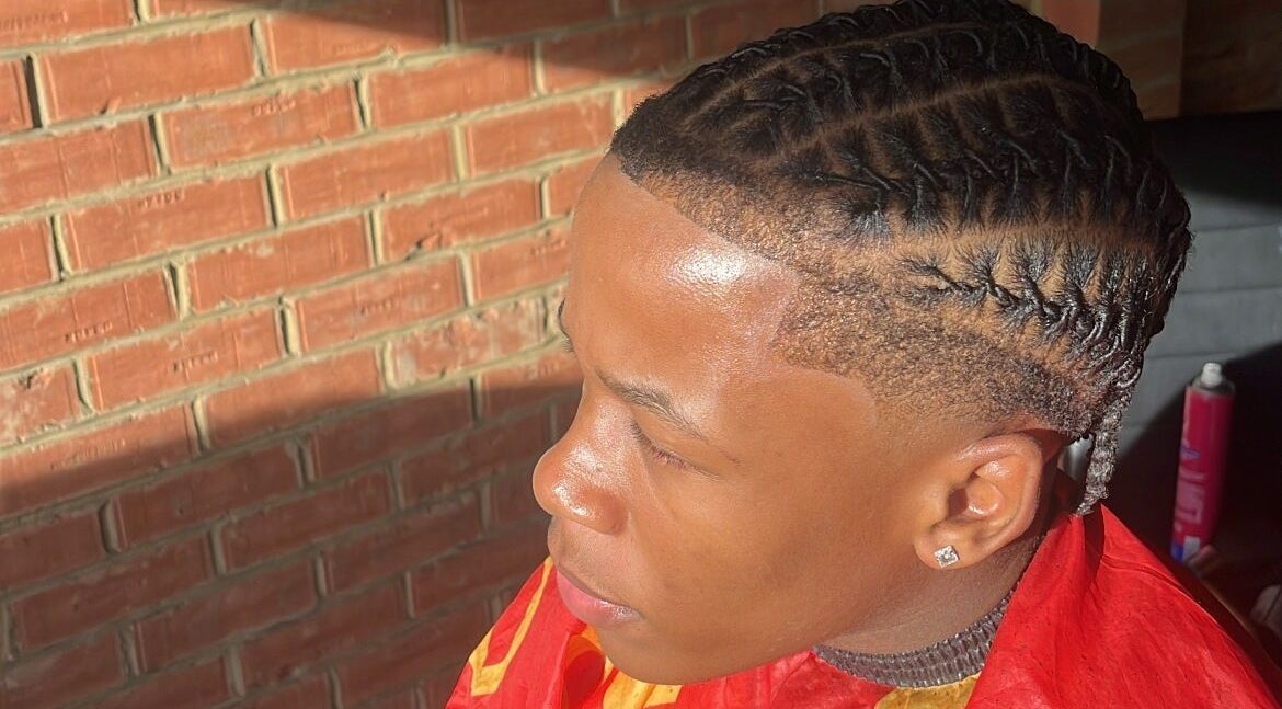 Intricate braided hairstyle at kcutz, Welwyn Garden City, England, GB, showcasing expert styling.