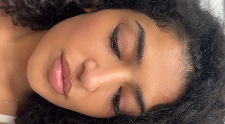 Relaxed person in a peaceful setting at Wellness Spa, Montréal, Québec, CA, enjoying tranquility.