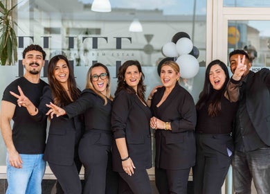 Lively team of Carvalho Barbeiro at Vale De Cambra, Aveiro, PT posing with smiles for a welcoming atmosphere.