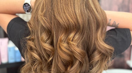 Lustrous golden curls styled at Pins & Curls, Weston-super-mare, England, GB. Perfect for a glamorous look.