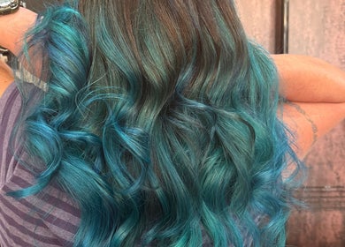 Vibrant blue curls styled at Pins & Curls, Weston-super-mare, England, GB.