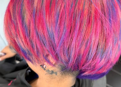 Bold pink and purple hair colors styled at Pins & Curls, Weston-super-mare, England, GB.
