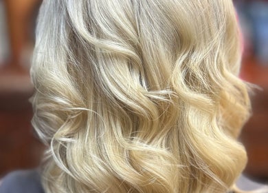 Elegant blonde waves styled at Pins & Curls, Weston-super-mare, England, GB beauty salon.
