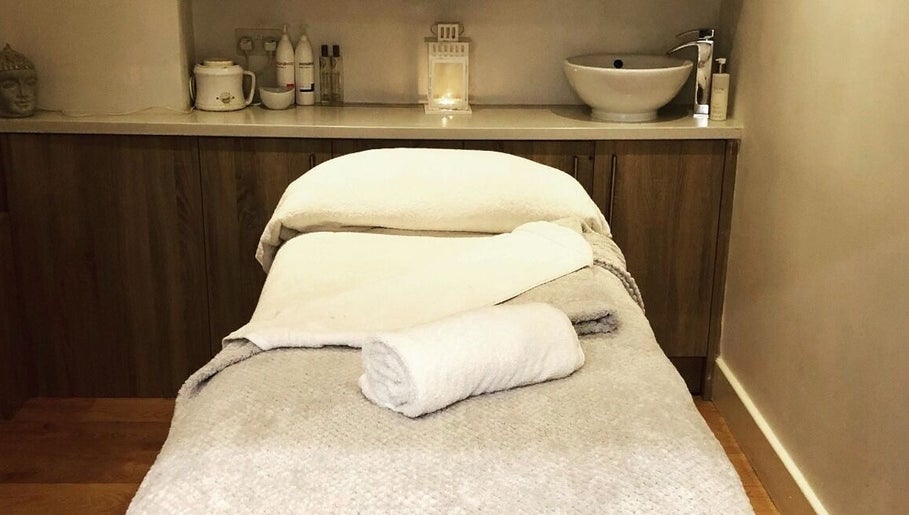 Tranquil massage room at Blissful Om Sports Massage in Brighouse, England, GB, with prepared table.