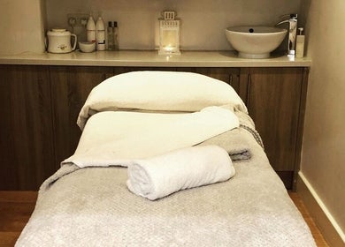 Tranquil massage room at Blissful Om Sports Massage in Brighouse, England, GB, with prepared table.
