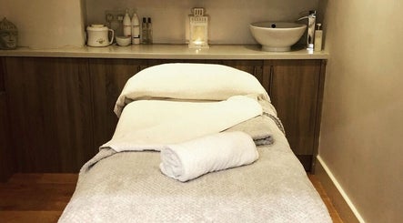 Tranquil massage room at Blissful Om Sports Massage in Brighouse, England, GB, with prepared table.