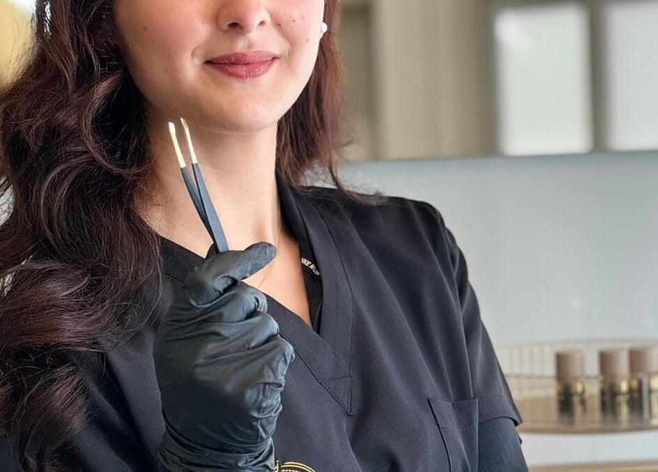 Expert brow specialist at Vera Brows, Perth, Scotland, GB, holding precision tools for perfect eyebrows.