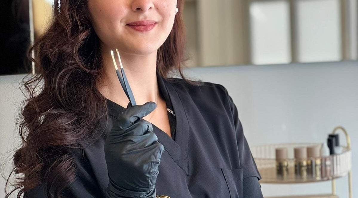 Expert brow specialist at Vera Brows, Perth, Scotland, GB, holding precision tools for perfect eyebrows.