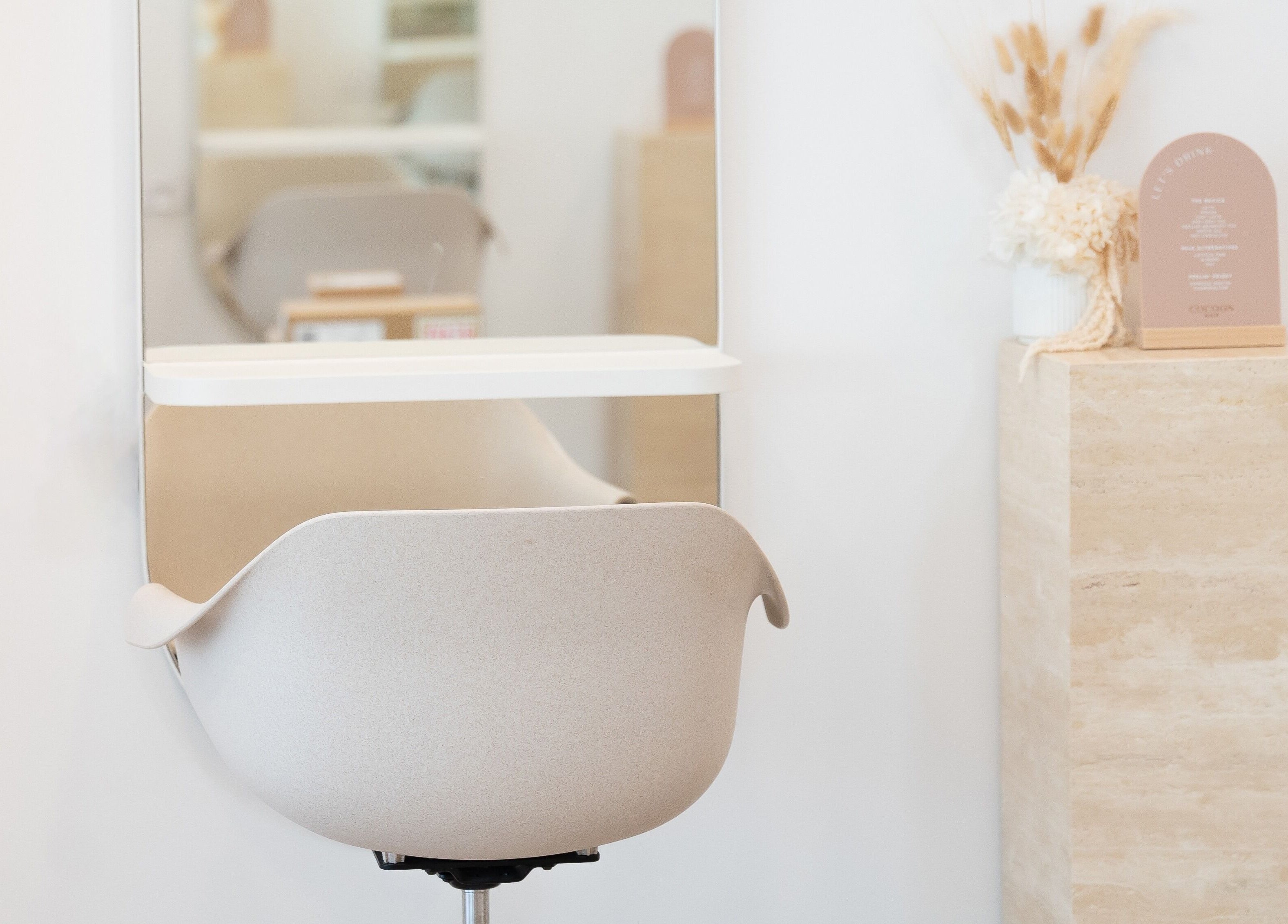 Modern styling chair and decor at Cocoon Hair, Bracken Ridge, Queensland, AU.