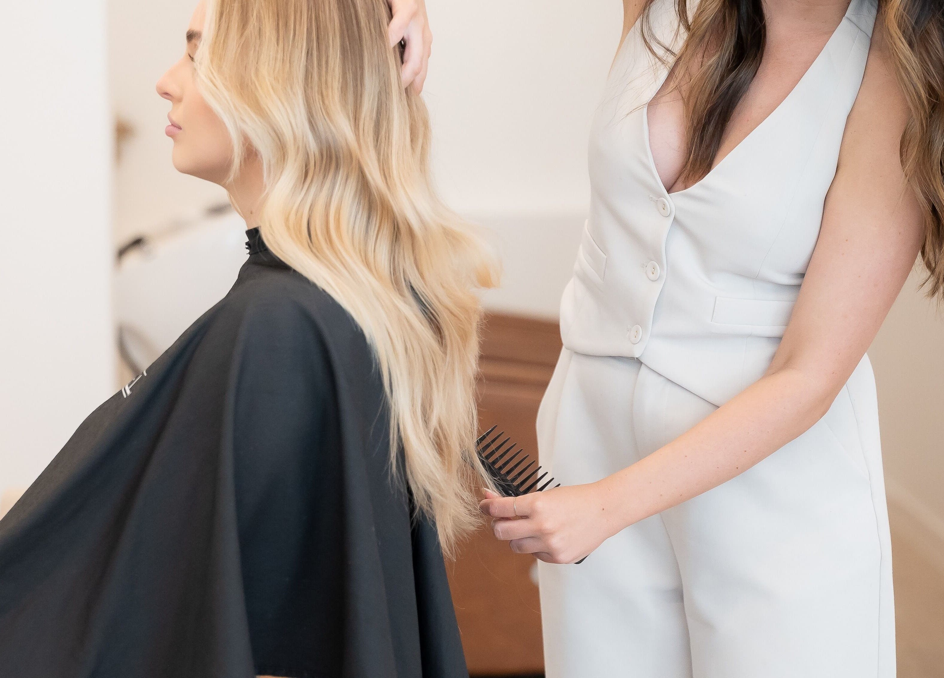 Hair stylist at Cocoon Hair in Bracken Ridge, Queensland, AU perfecting a blonde style.