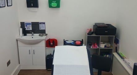 Luxe Ink treatment room featuring a sink and supplies in Motherwell, Scotland, GB.