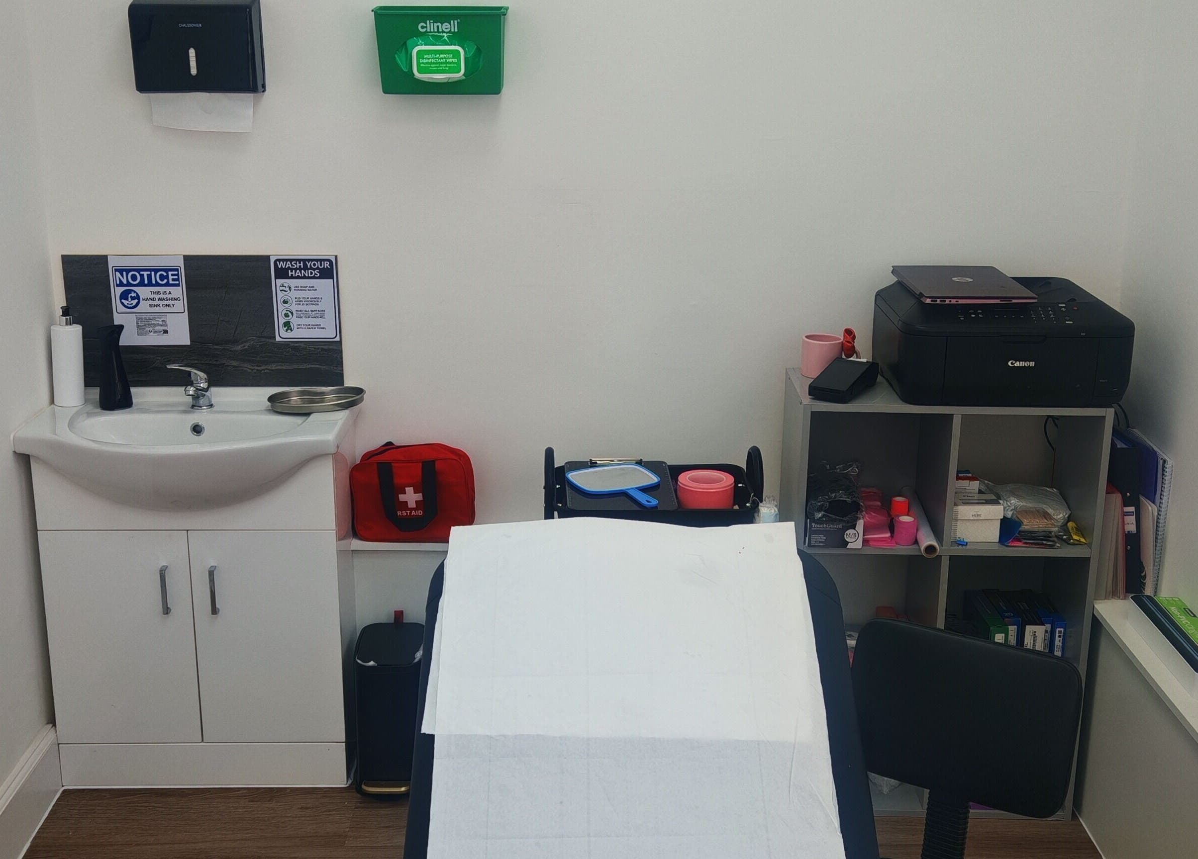 Treatment room at Luxe Ink with sink and supplies, Motherwell, Scotland, GB.