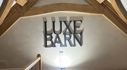 Luxe Barn sign inside Tommo’s Treatments, Tickenham, England, GB showcasing stylish interior design.