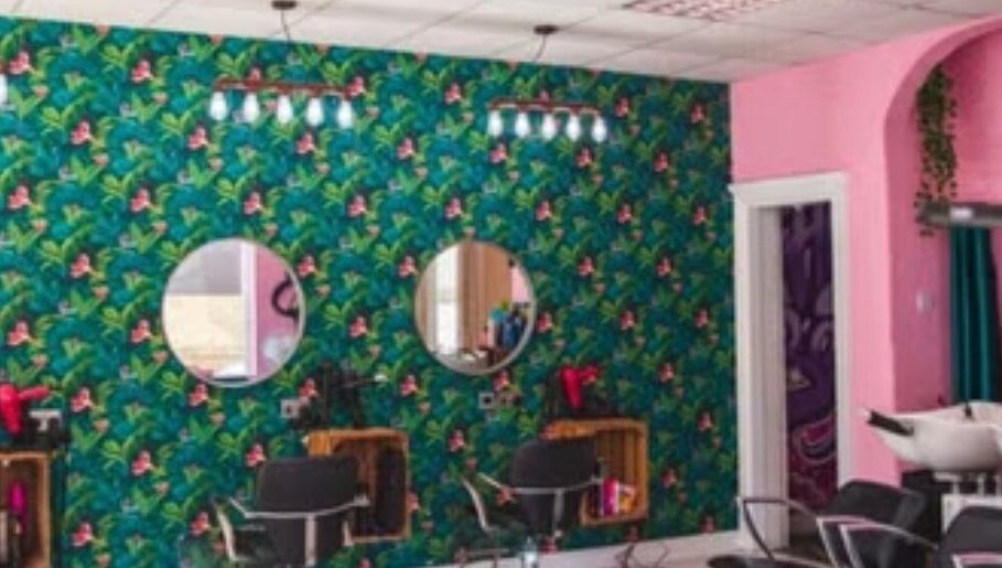 Vibrant floral salon decor at Hair_by_faith_s in Liversedge, England, GB featuring stylish styling chairs.
