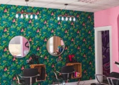Vibrant floral salon decor at Hair_by_faith_s in Liversedge, England, GB featuring stylish styling chairs.