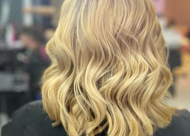 Elegant wavy blonde hair styled at Hair_by_faith_s in Liversedge, England, GB.