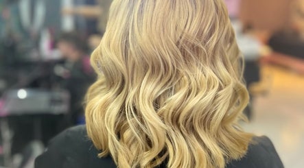 Elegant wavy blonde hair styled at Hair_by_faith_s in Liversedge, England, GB.