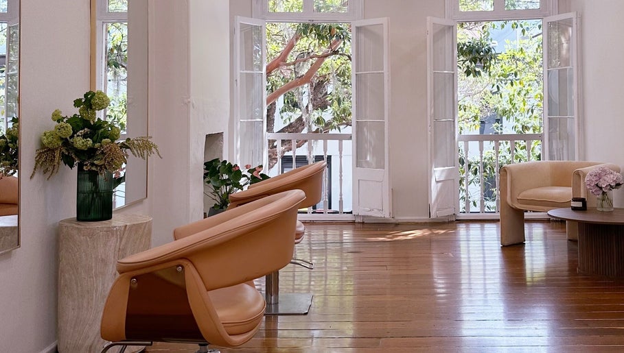 Bright, elegant interior of Stephanie Whitaker Hair in Darlinghurst, New South Wales, AU, with chic seating.