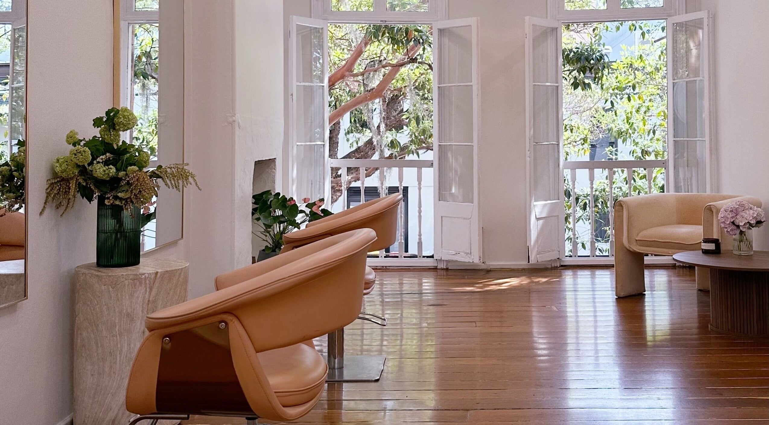 Bright, elegant interior of Stephanie Whitaker Hair in Darlinghurst, New South Wales, AU, with chic seating.