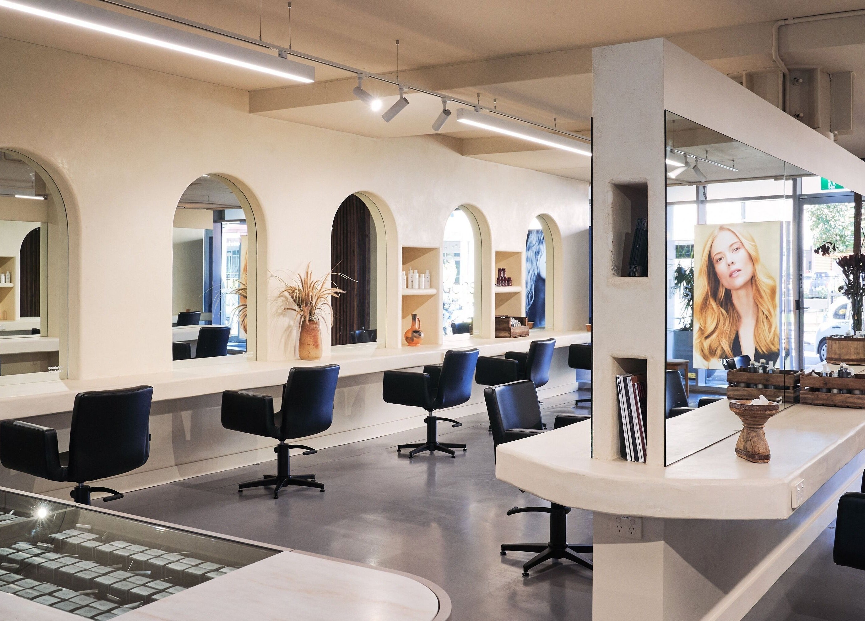 Modern interior of Fuchs Hair at Alexandria, New South Wales, AU with stylish styling stations and mirrors.
