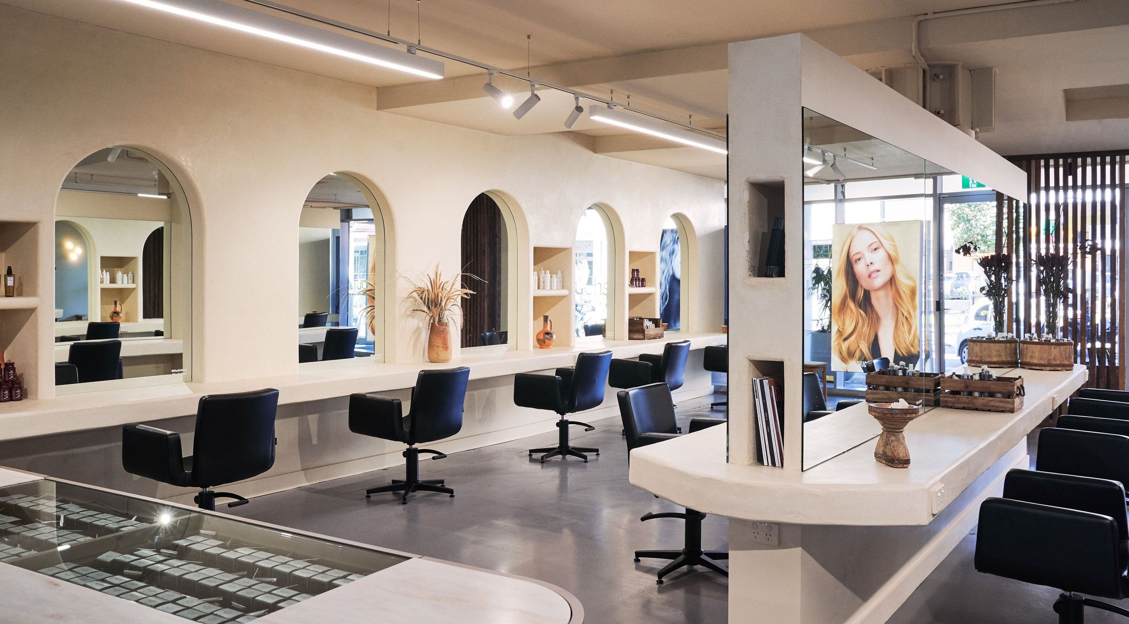 Modern interior of Fuchs Hair at Alexandria, New South Wales, AU with stylish styling stations and mirrors.
