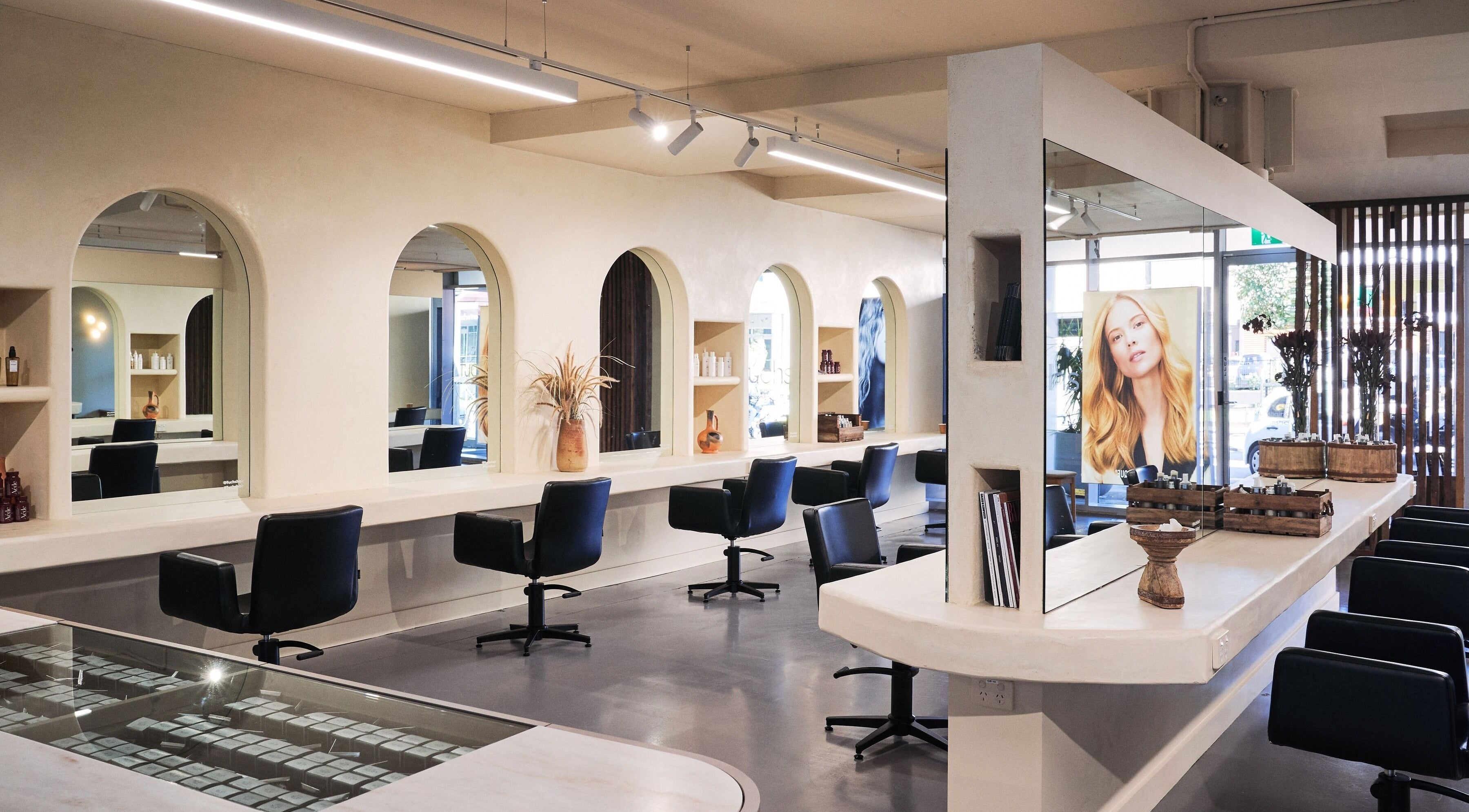 Modern interior of Fuchs Hair at Alexandria, New South Wales, AU with stylish styling stations and mirrors.