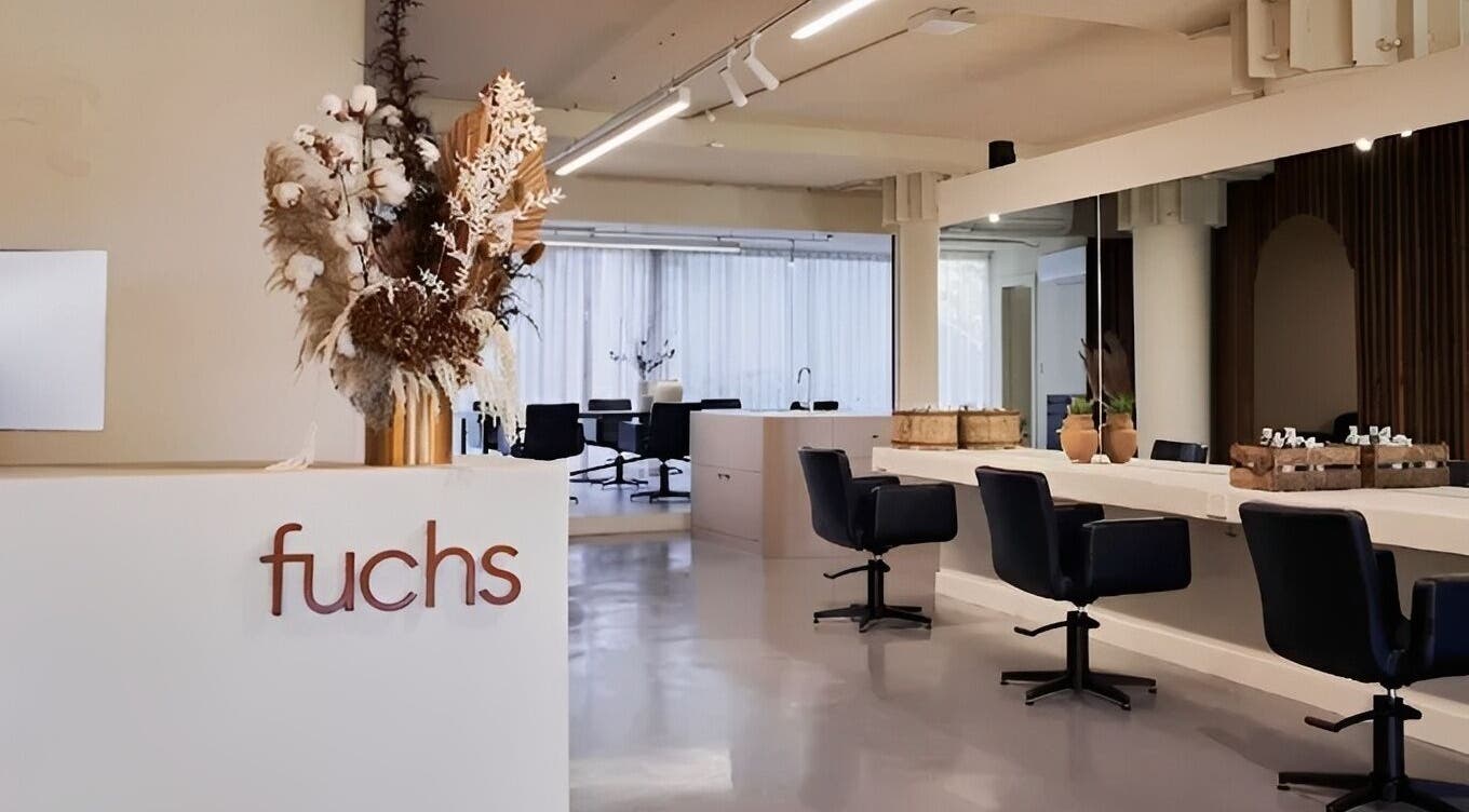 Modern interior of Fuchs Hair in Alexandria, New South Wales, AU featuring sleek styling stations and elegant decor.