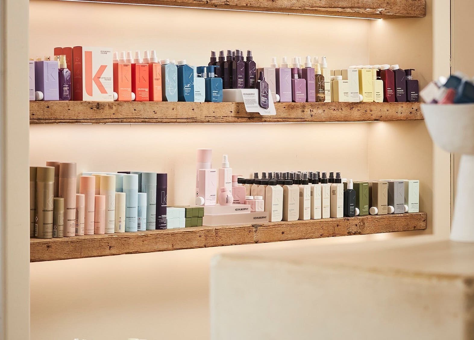 Fuchs Hair salon showcases premium hair products on wooden shelves in Alexandria, New South Wales, AU.