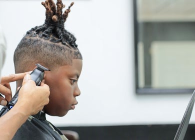 Haircut in progress at Image Unisex Barbershop and Salon, Sicklerville, New Jersey, US.