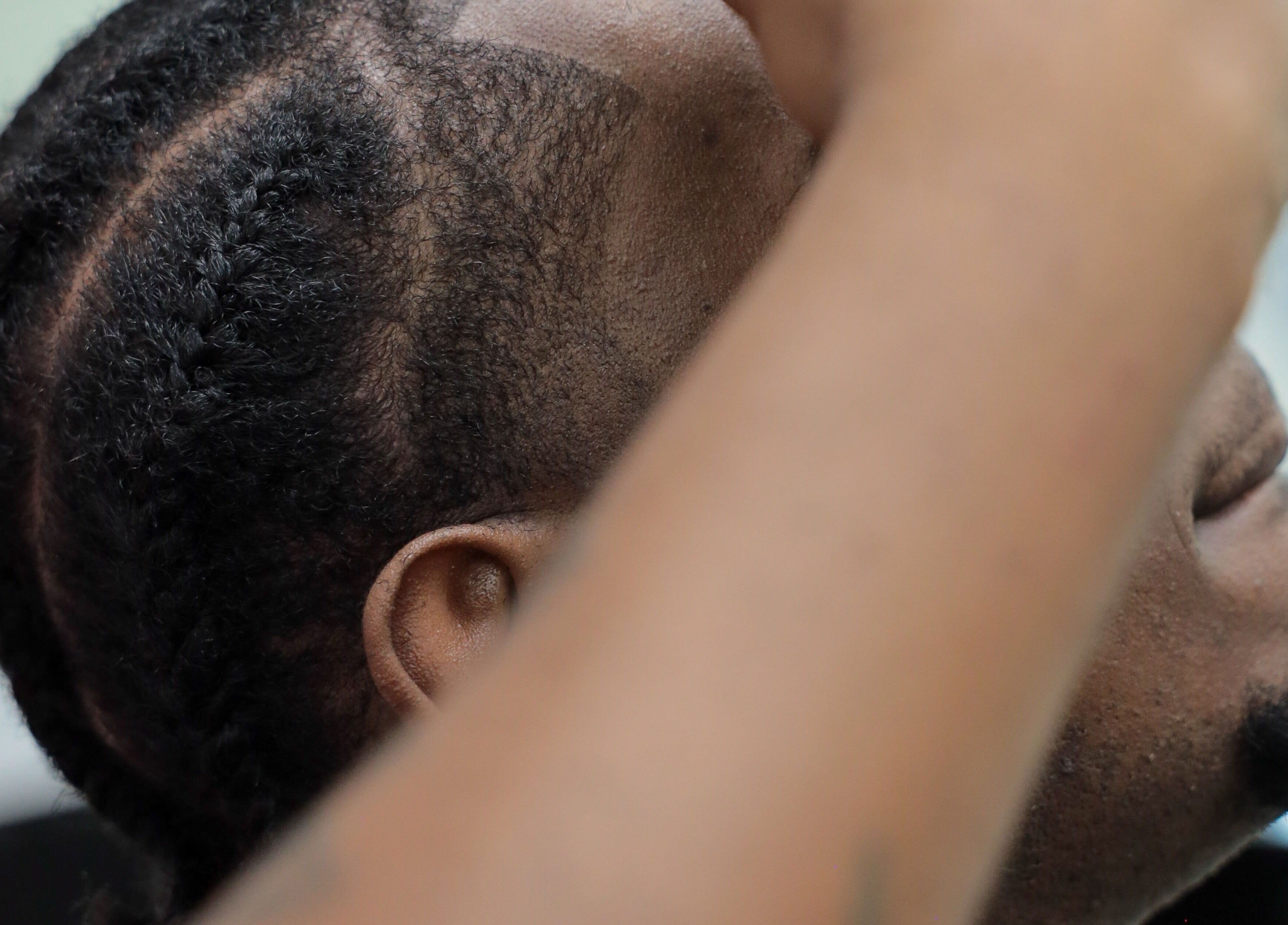 Close-up of intricate braiding at Image Unisex Barbershop and Salon in Sicklerville, New Jersey, US.